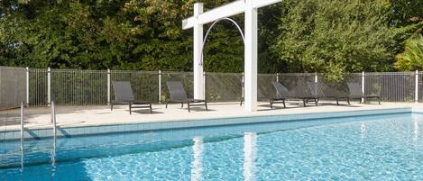 Outdoor pool, open 10:00 AM to 8:30 PM, pool loungers