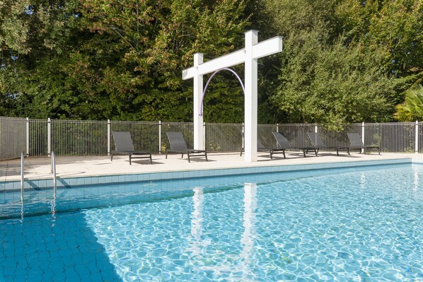 Outdoor pool, open 10:00 AM to 8:30 PM, pool loungers