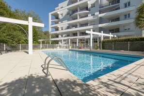 Outdoor pool, open 10:00 AM to 8:30 PM, pool loungers