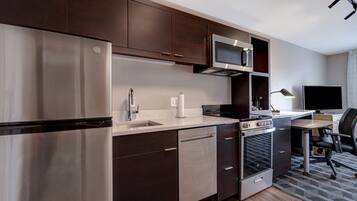 A modern kitchen with stainless steel appliances, a microwave, and a built-in oven.