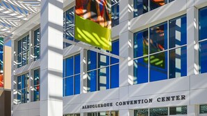The Albuquerque Convention Center with a modern architectural design, featuring large windows and a prominent entrance. - La Quinta Inn & Suites by Wyndham Albuquerque Midtown (Albuquerque)