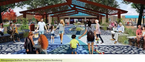 A spacious outdoor area with a pavilion, seating areas, and walking paths.