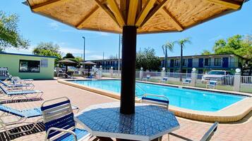 Seasonal outdoor pool, pool loungers