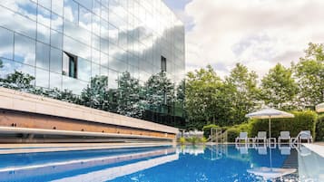 Seasonal outdoor pool, open 11:00 AM to 8:00 PM, pool umbrellas