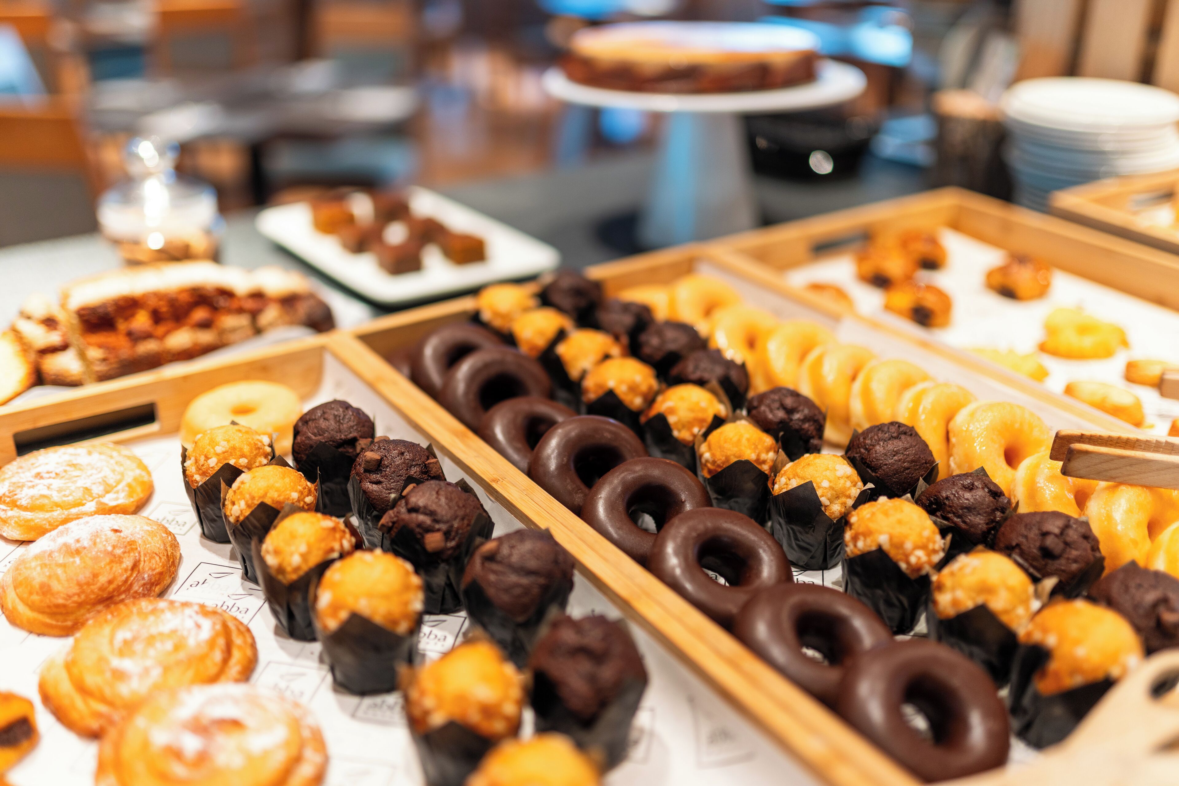 A buffet with various pastries and desserts.