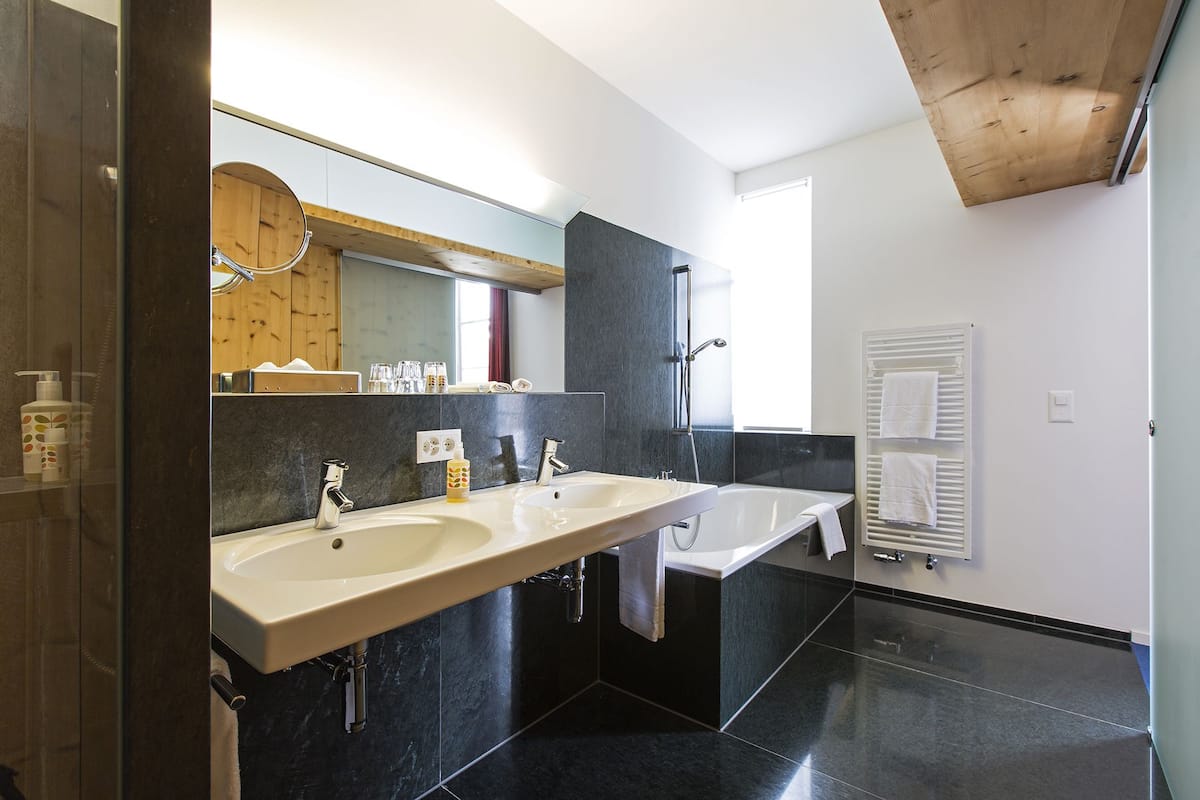 junior suite, valley view | bathroom | hair dryer, bathrobes, slippers, towels