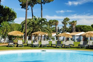 Indoor pool, outdoor pool, pool umbrellas, pool loungers