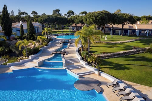 Indoor pool, outdoor pool, pool umbrellas, pool loungers