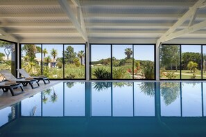 Indoor pool, outdoor pool, pool umbrellas, sun loungers