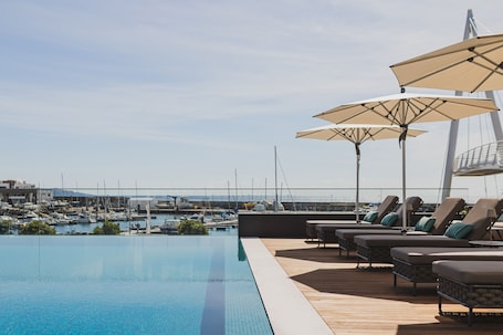 Indoor pool, outdoor pool, pool umbrellas, sun loungers