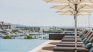 Indoor pool, outdoor pool, pool umbrellas, sun loungers