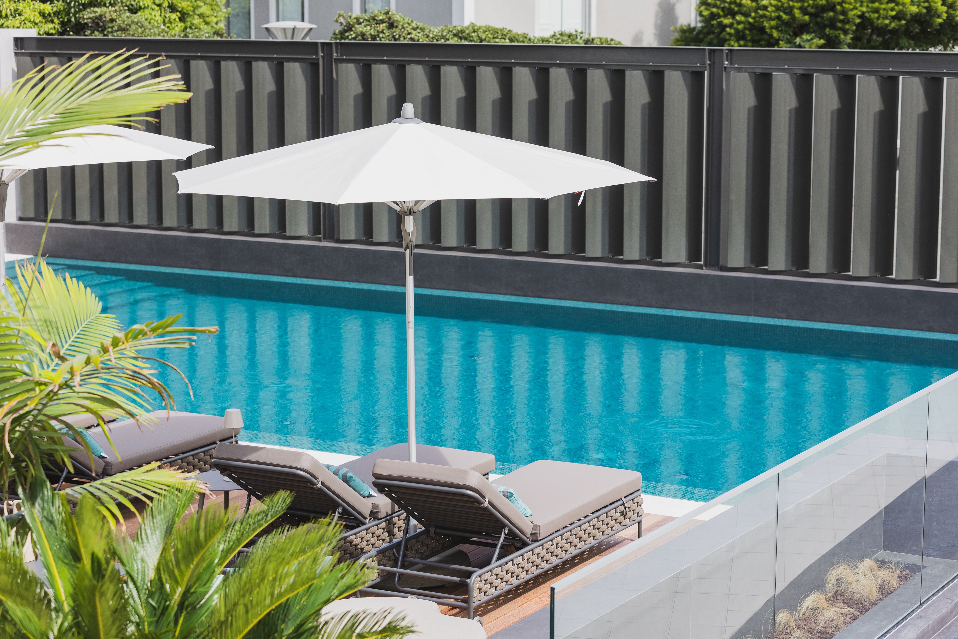 indoor pool, outdoor pool, pool umbrellas, pool loungers