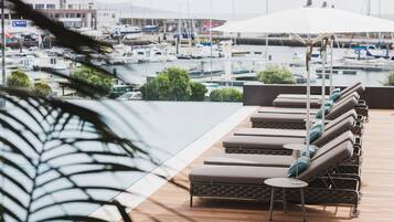 Indoor pool, outdoor pool, pool umbrellas, sun loungers