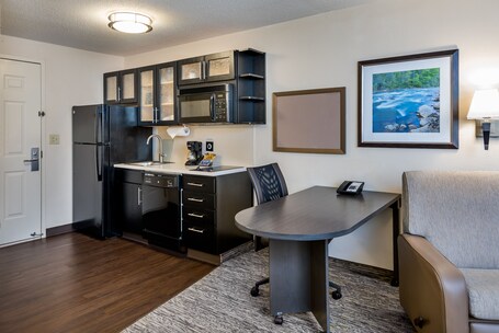 Desk, laptop workspace, blackout drapes, iron/ironing board