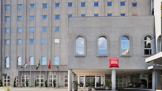 A hotel with a modern facade, multiple windows, and a prominent ibis logo. - ibis Sao Paulo Interlagos (São Paulo)