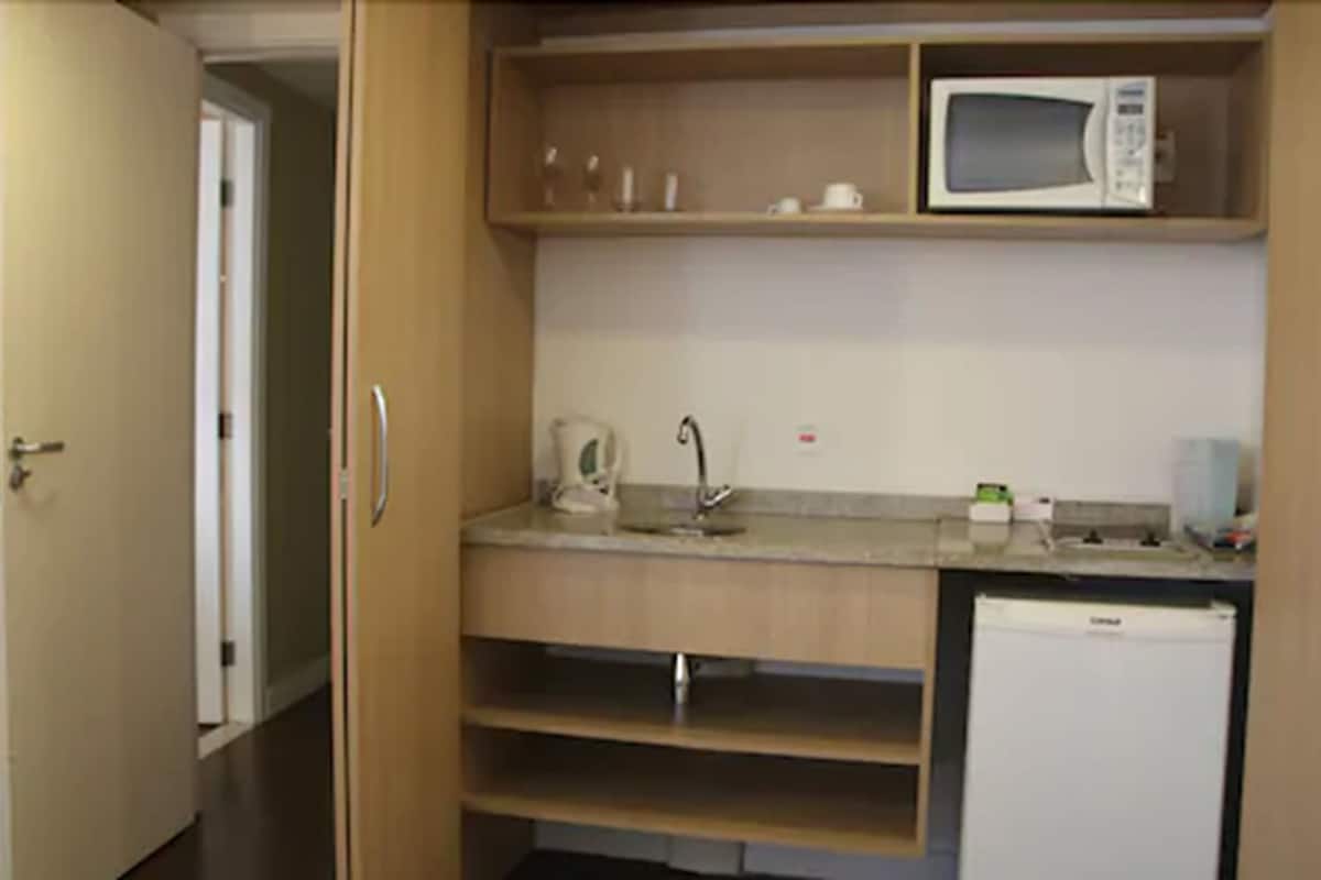 mini-fridge, microwave, stovetop, electric kettle