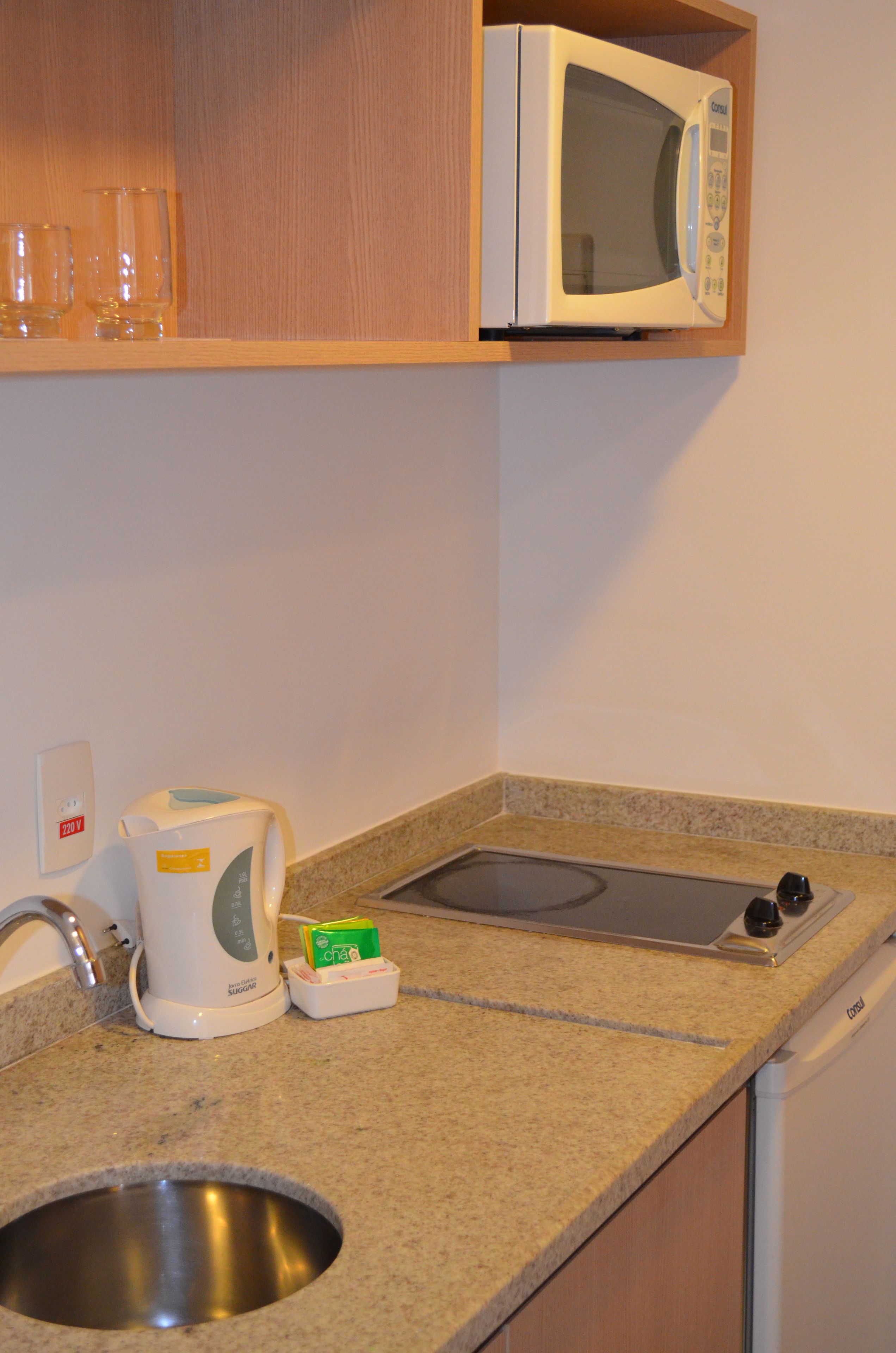 mini-fridge, microwave, stovetop, electric kettle