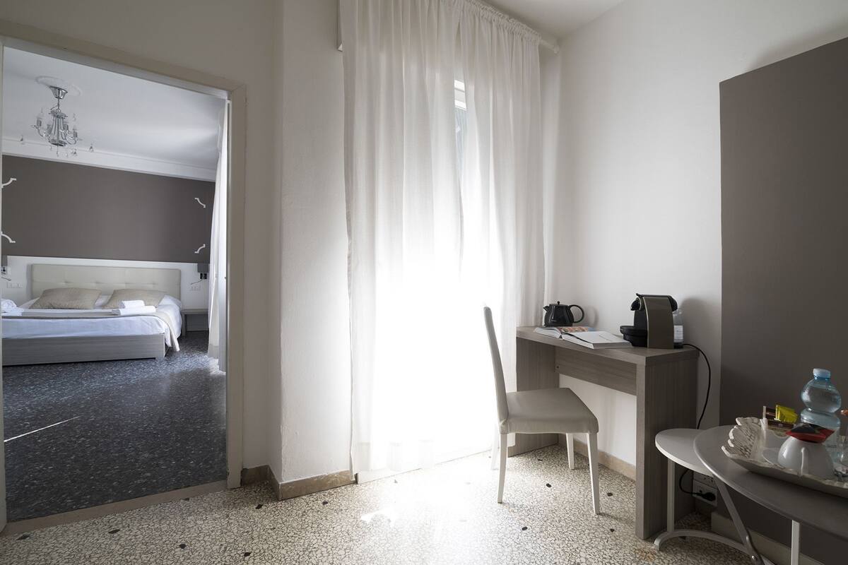 Triple Room | Desk, blackout drapes, WiFi (free), bed sheets