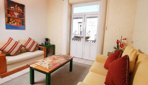 Suite | Living room | 25-inch flat-screen TV with digital channels, TV