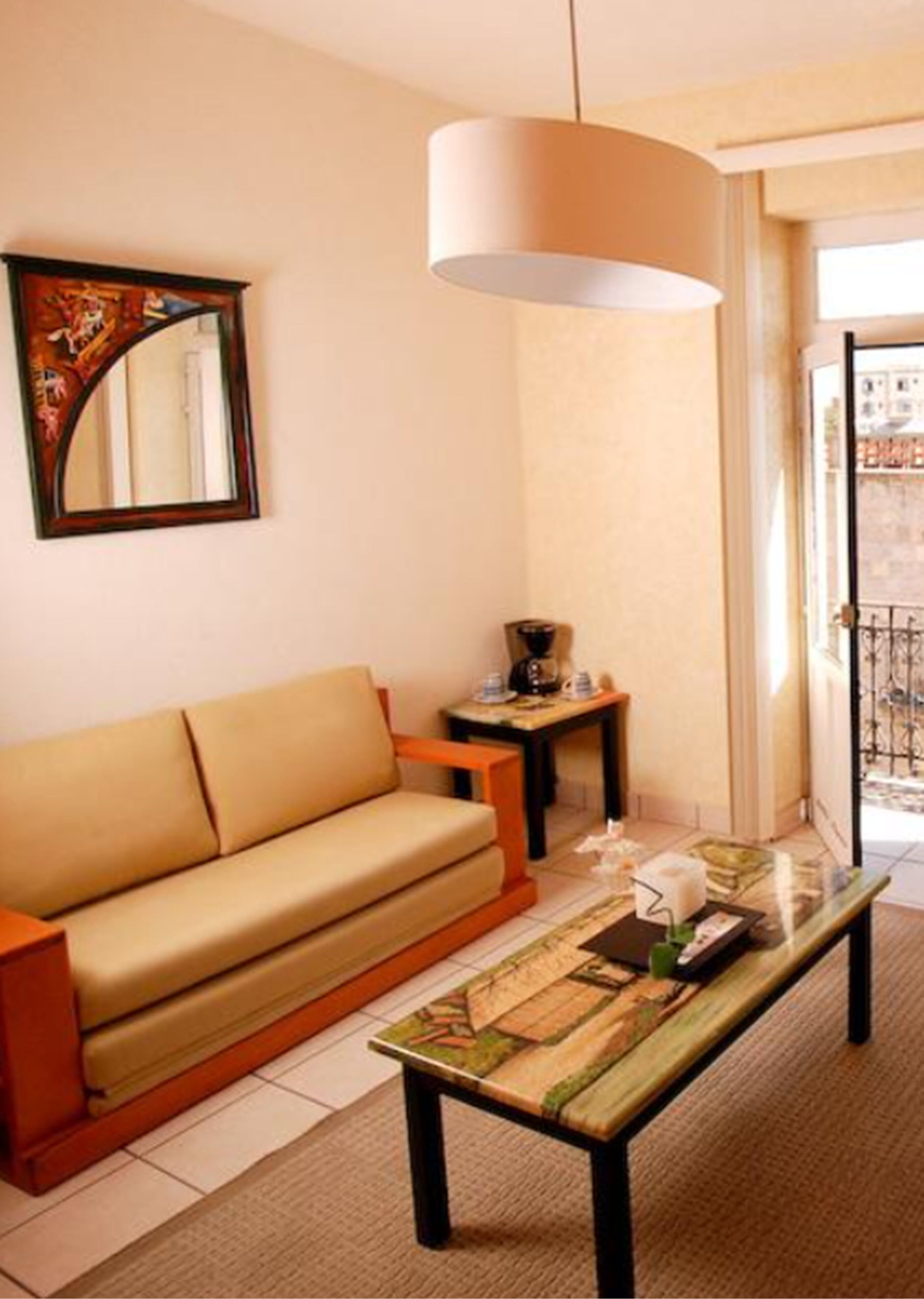 junior suite, 1 king bed with sofa bed | living room | 25-inch flat-screen tv with digital channels, tv