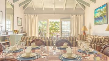 Signature Villa, 3 Bedrooms, Ocean View, Beachfront | Living area | 32-inch TV with cable channels