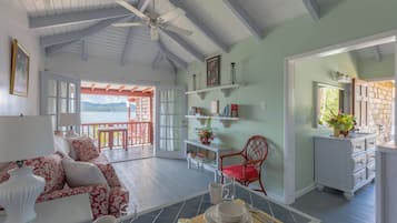 Classic Villa, 1 King Bed, Kitchen, Ocean View | Living area | 21-inch TV with cable channels