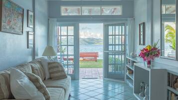 Deluxe Villa, 1 King Bed, Ocean View, Corner | Living area | 32-inch TV with cable channels