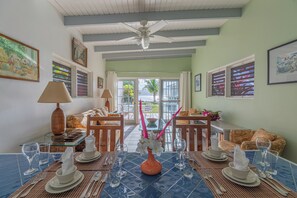 Deluxe Villa, 2 Bedrooms, Ocean View, Beachfront | Living area | 32-inch TV with cable channels - Fort Recovery Beachfront Resort (West End)