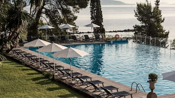 Indoor pool, seasonal outdoor pool, pool umbrellas, pool loungers