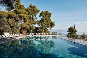 Indoor pool, seasonal outdoor pool, pool umbrellas, pool loungers