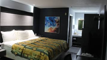 Deluxe Single Room | Desk, laptop workspace, blackout drapes, iron/ironing board