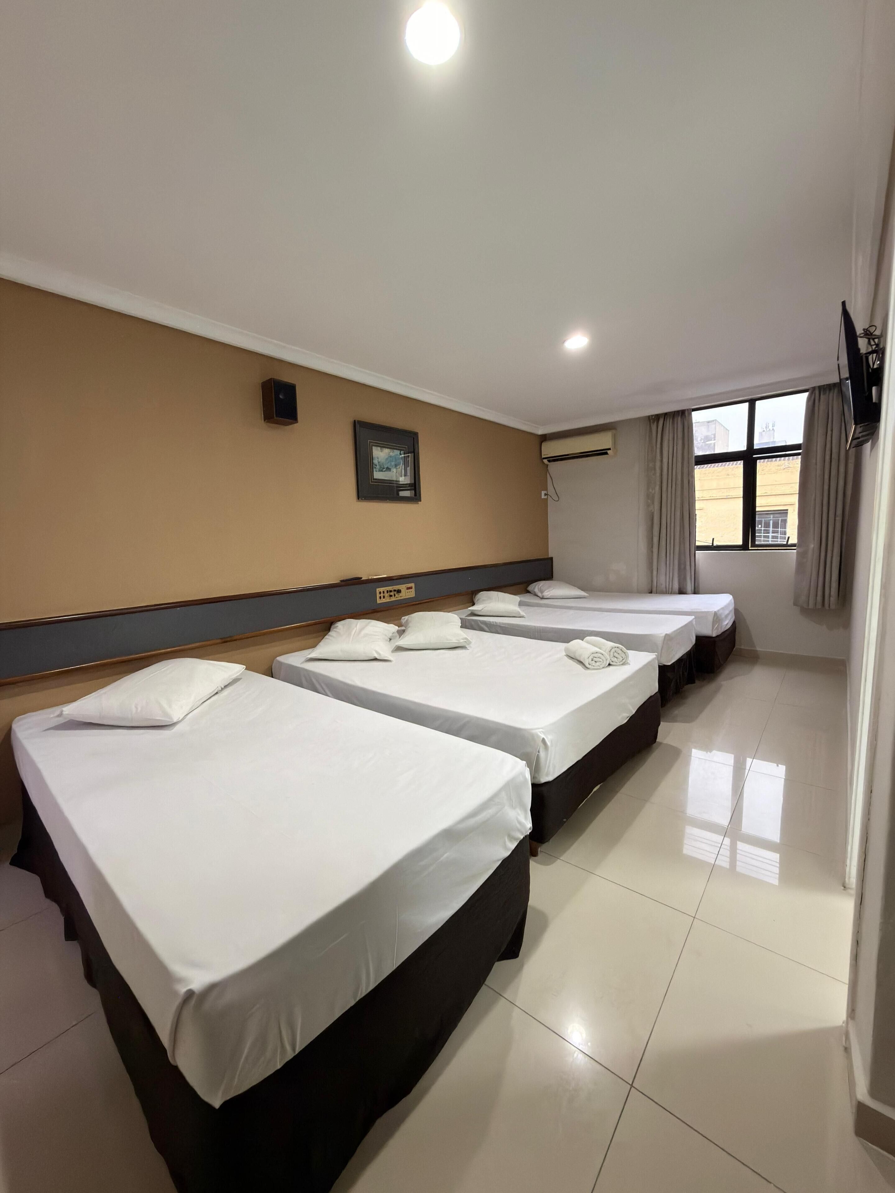 Triple Room | Minibar, desk, free cribs/infant beds, rollaway beds