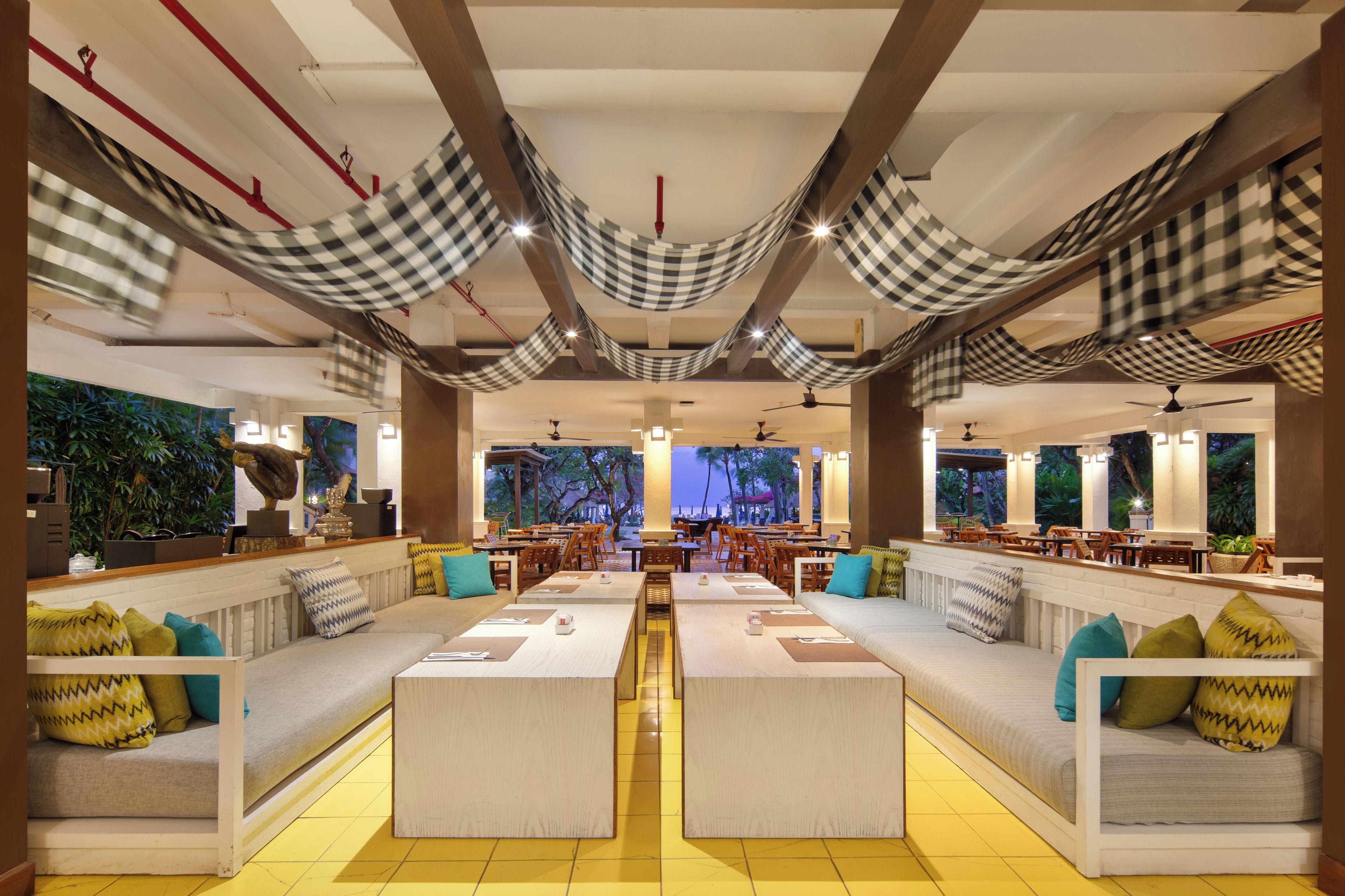 A spacious indoor area with seating arrangements and a view of the outdoors.