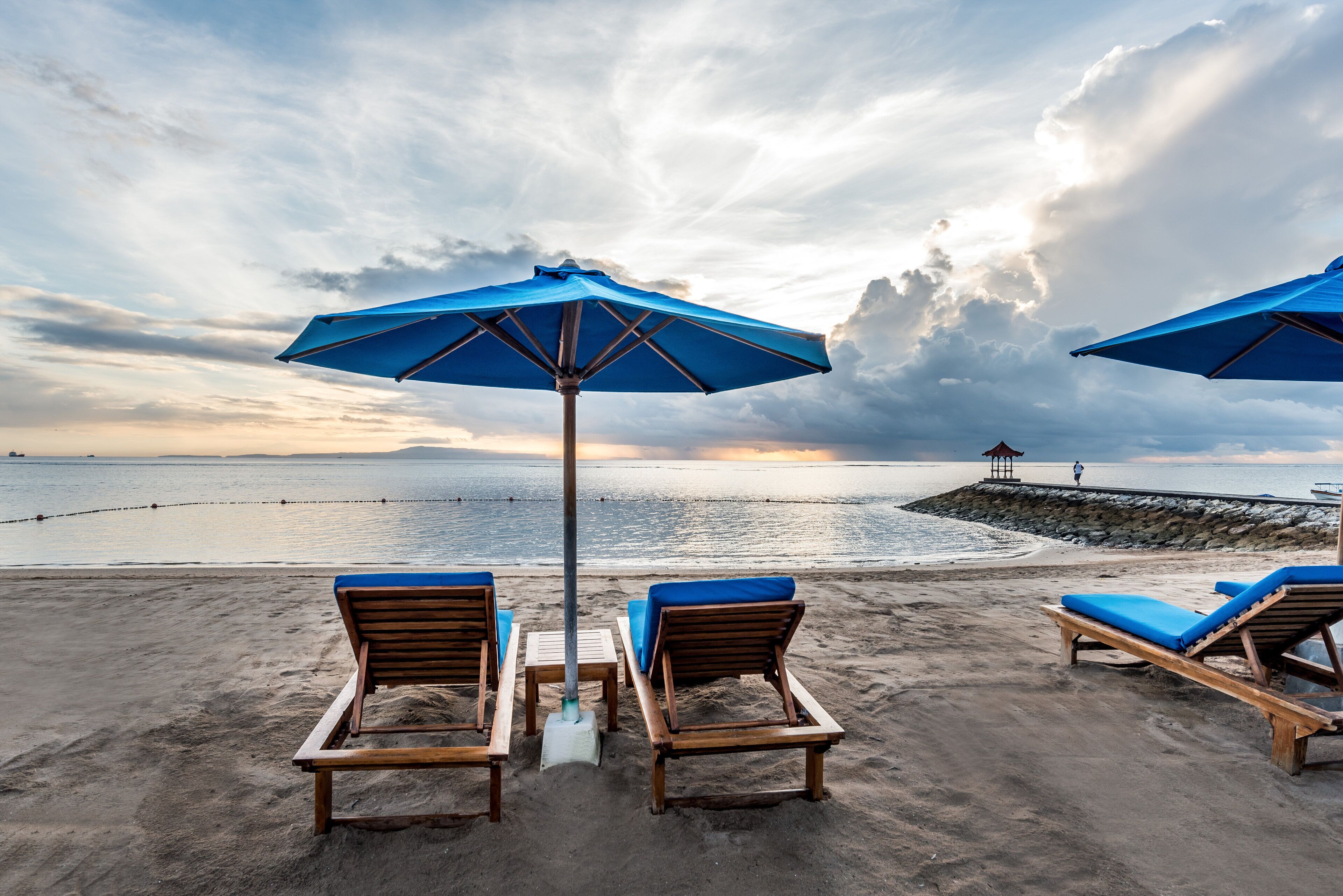 On the beach, white sand, beach umbrellas, beach towels