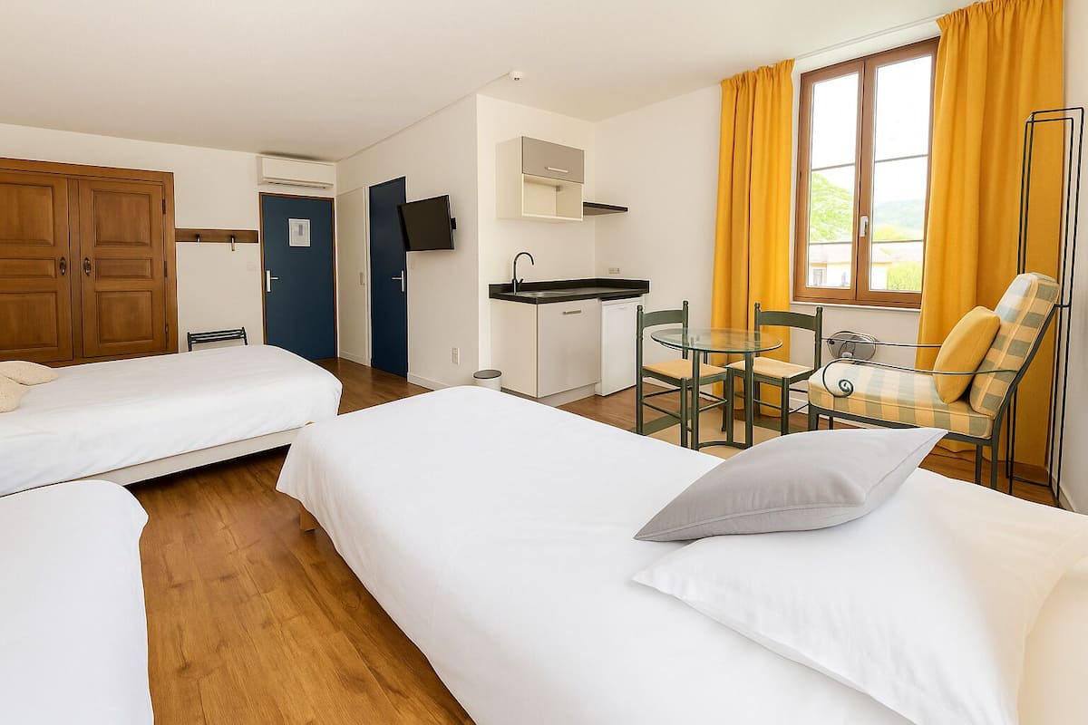 superior quadruple room | in-room safe, desk, soundproofing, iron/ironing board