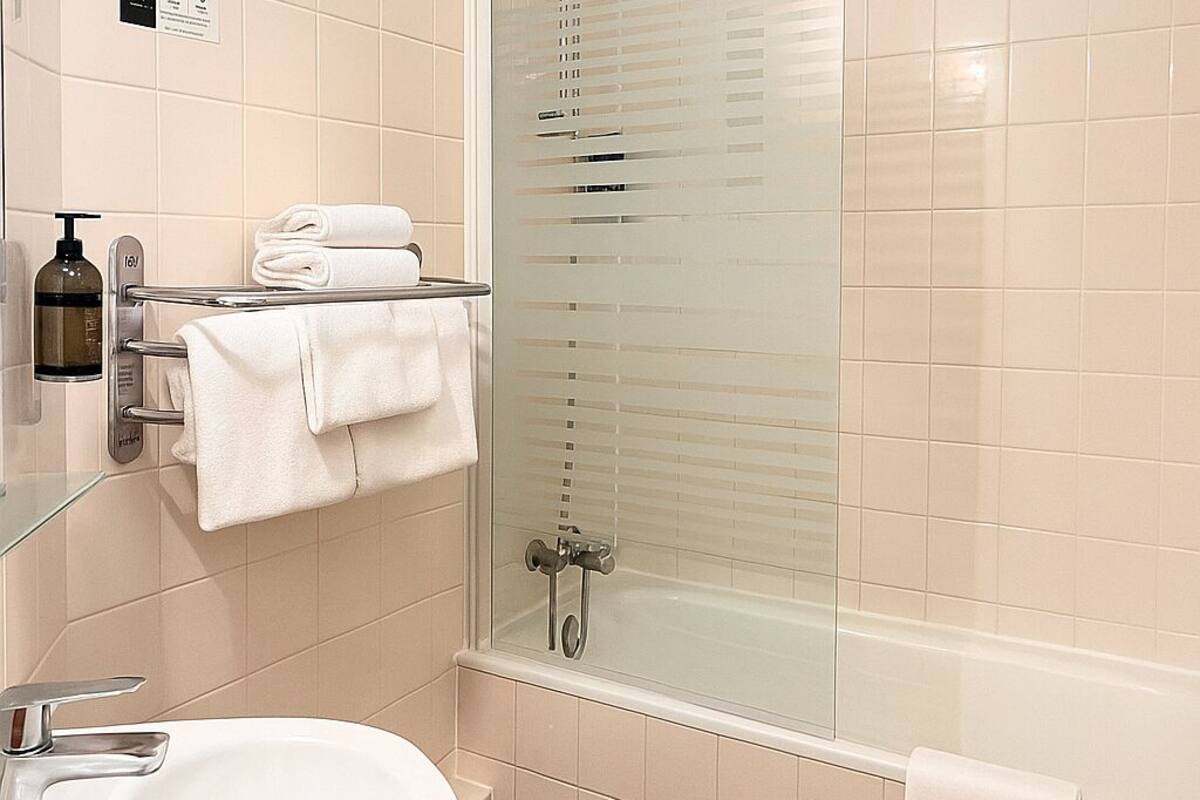 superior triple room | bathroom | free toiletries, hair dryer
