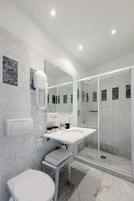 Shower, free toiletries, hair dryer, slippers