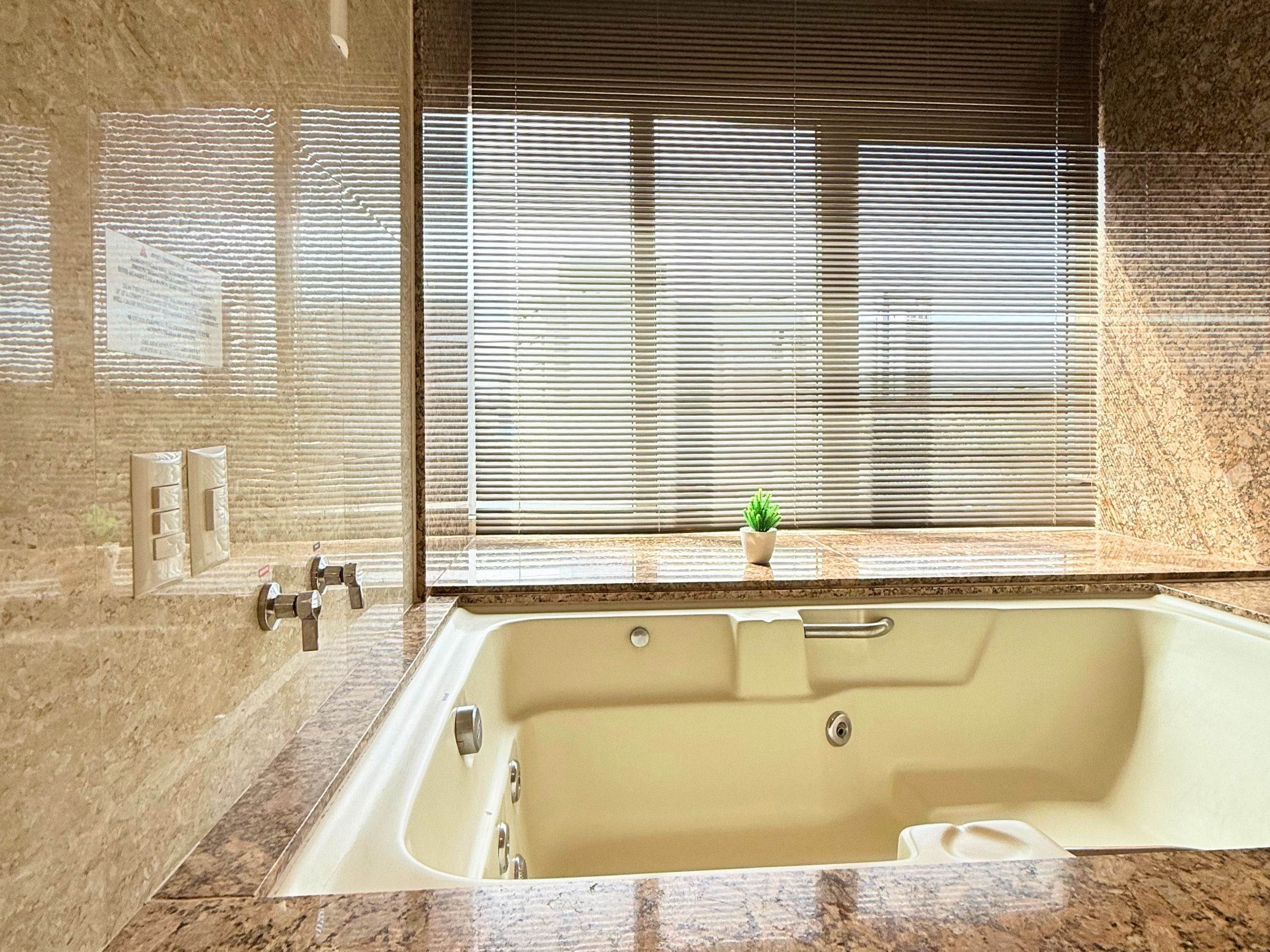 premier suite | bathroom | shower, hair dryer, towels