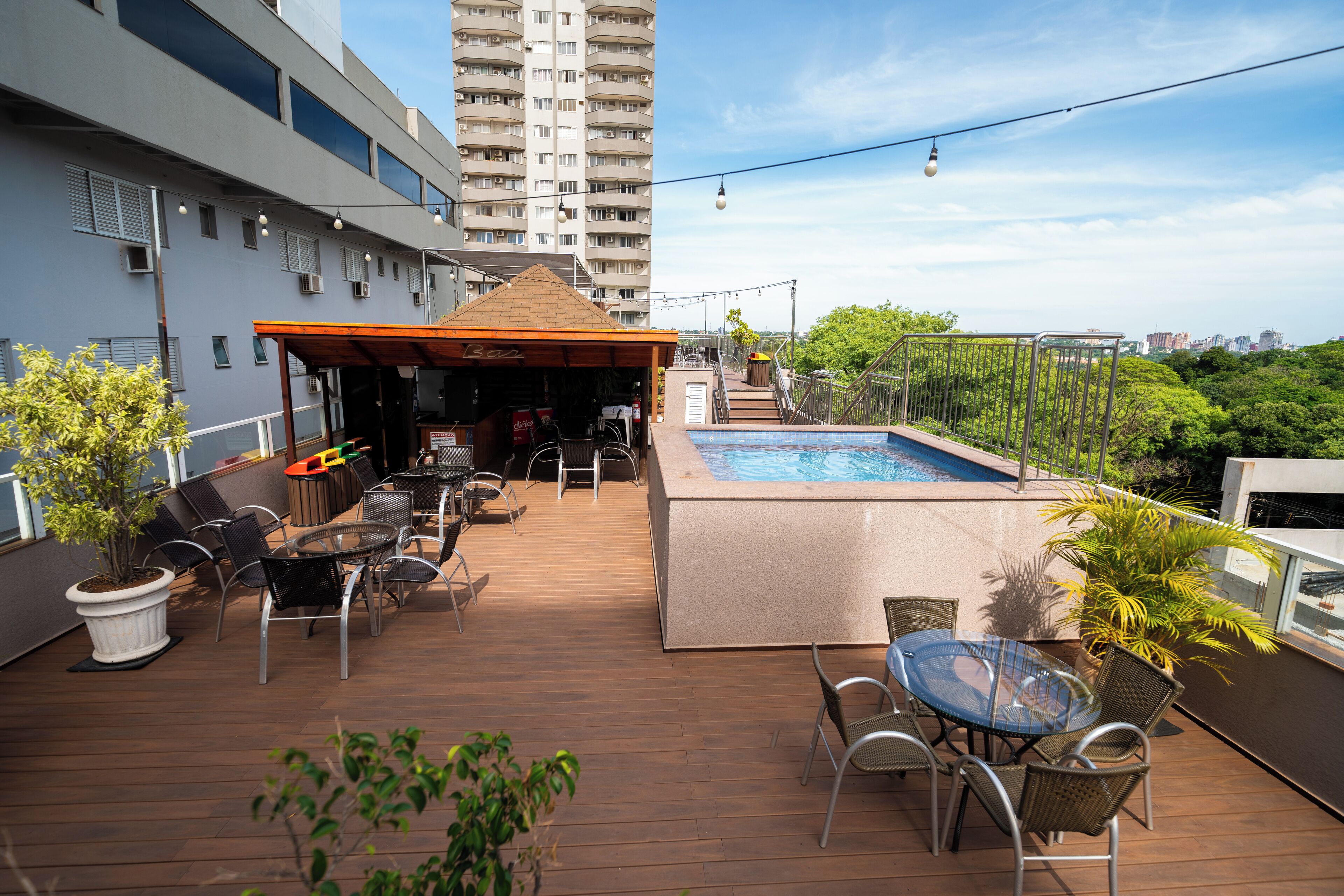 outdoor pool, open 10:00 am to 11:00 pm, pool umbrellas, pool loungers