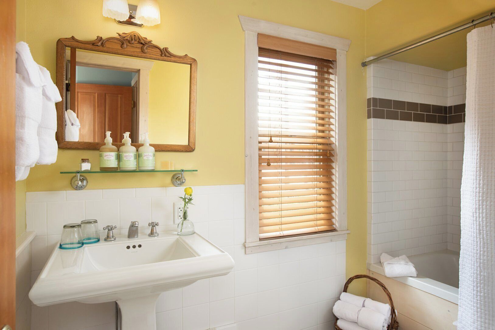 combined shower/bathtub, designer toiletries, hair dryer, bathrobes