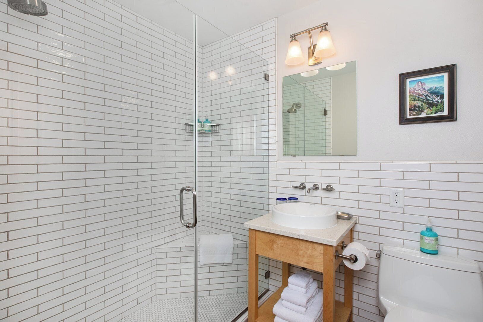 combined shower/bathtub, designer toiletries, hair dryer, bathrobes