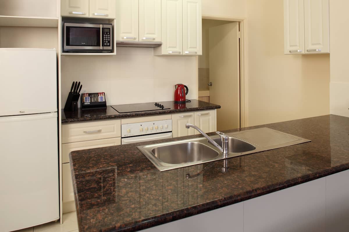 full-sized fridge, microwave, stovetop, coffee/tea maker