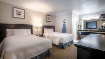 Desk, blackout drapes, iron/ironing board, rollaway beds