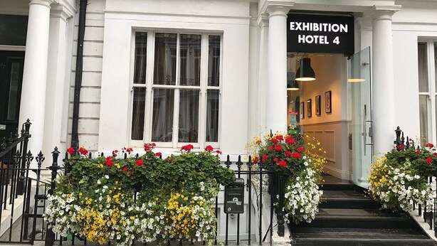 A hotel entrance with a sign reading "Exhibition Hotel 4." - Exhibition Court Hotel 4 (London)