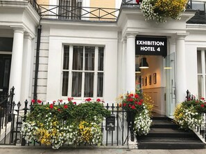A hotel entrance with a sign reading "Exhibition Hotel 4." - Exhibition Court Hotel 4 (London)