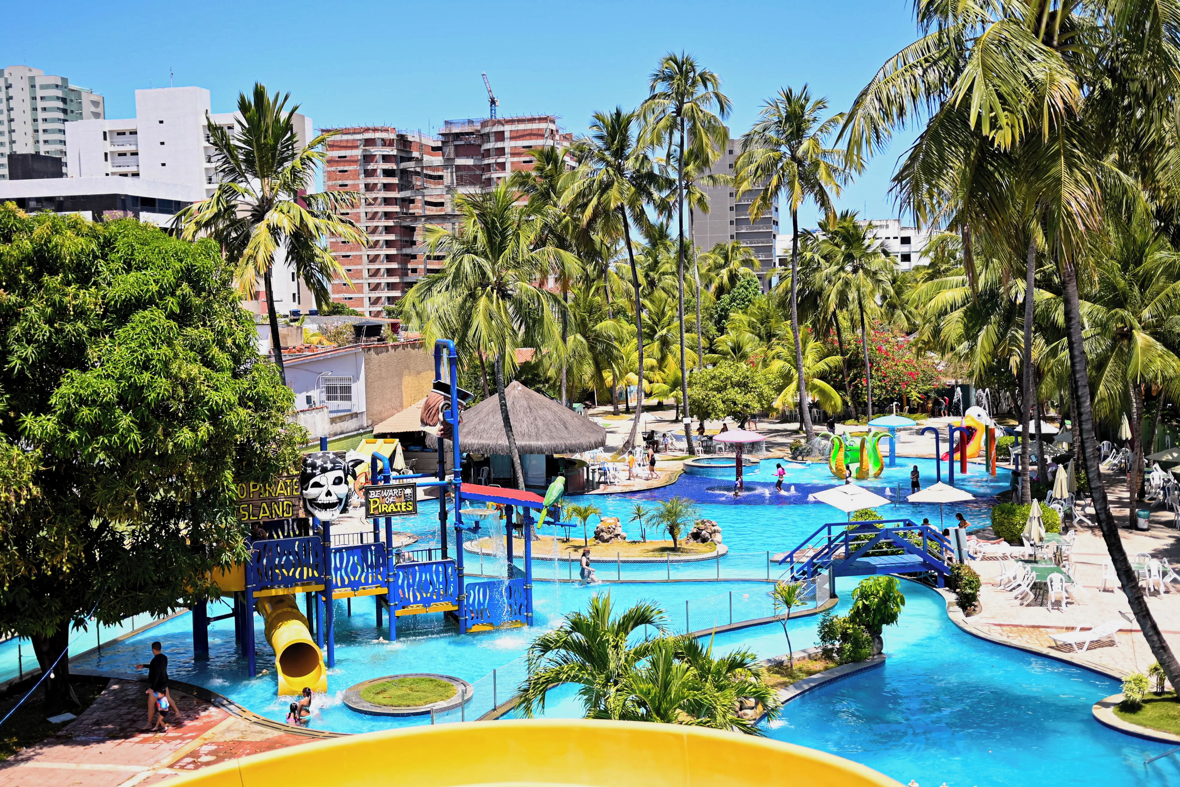 A water park with multiple pools, slides, and a pirate-themed area.