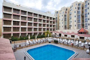 Outdoor pool, pool umbrellas, pool loungers - The Santa Maria Hotel (St. Paul's Bay)