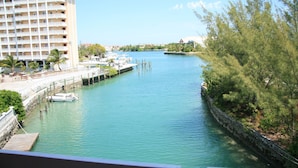 A waterfront hotel with a marina, a dock, and a stone wall along the water. - Bell Channel Inn Hotel (Freeport)