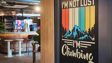 A poster with the text "I'M NOT LOST I'M CLIMBING" and a mountain graphic.