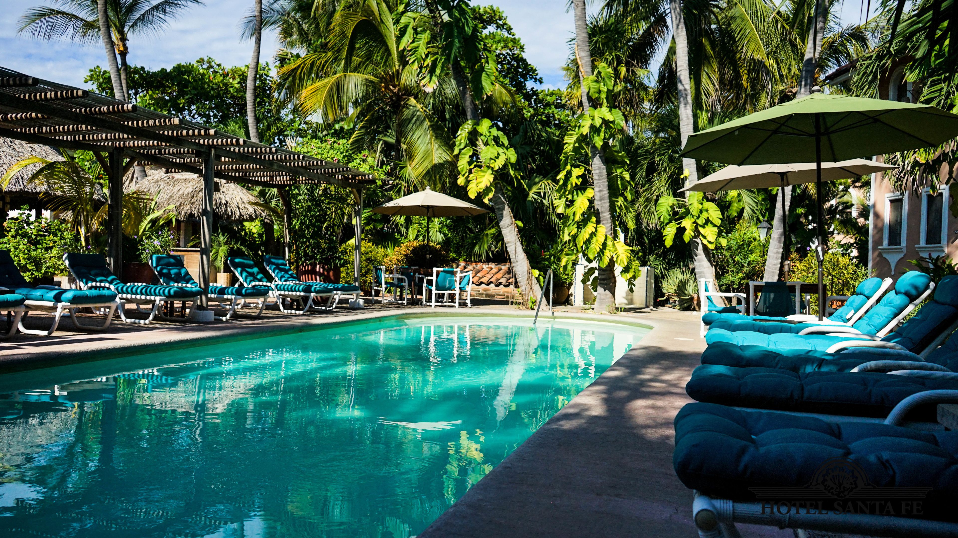 3 outdoor pools, open 7:00 AM to 9:00 PM, pool umbrellas